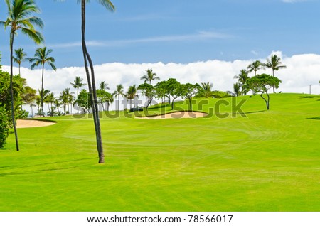 Golf place with gorgeous green and beautiful white clouds over blue sky view