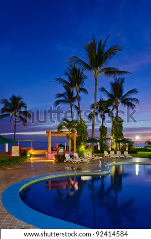 luxury resort with beautiful pool and fantastic ocean view at night