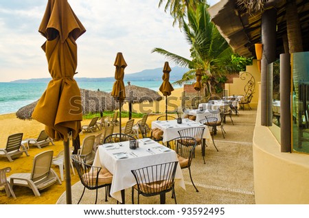 Outdoor restaurant at the beach in luxury resort in Mexico.