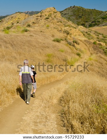 Two friends travel together to mountains on the Long Canyon trail at Simi Valley, California, US