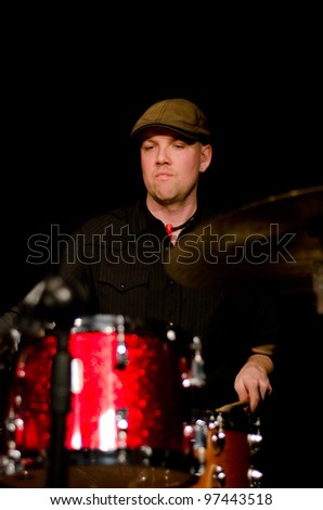 VANCOUVER, CANADA - FEBRUARY 9: jazz band Tambura Rasa. Trevor Grant (drums) on the stage of The Jazz Cellar on February 9, 2011 in Vancouver, Canada.