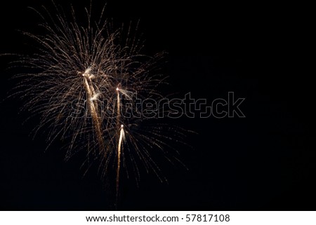 Bright gold colored fireworks at left of frame