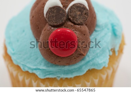Close up of a reindeer made of chocolate with a red nose