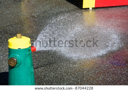 Toy fire hydrant spraying water in water park