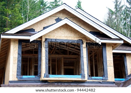 A wooden frame house under construction