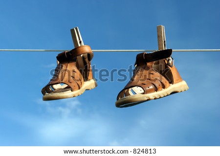 Couple of Boots Hanging on a Rope