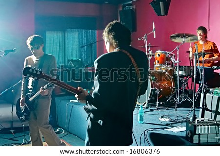 three music performers on scene