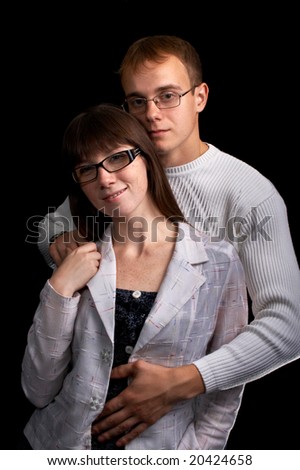 portrait loving couple isolated on black background