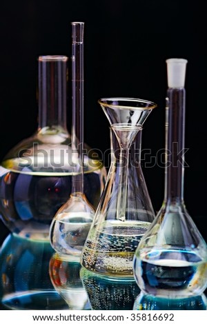 laboratory flasks on turn blue background