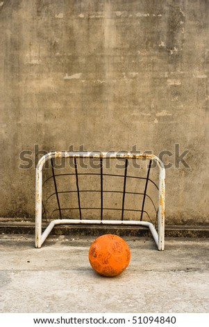 Orange football and goal