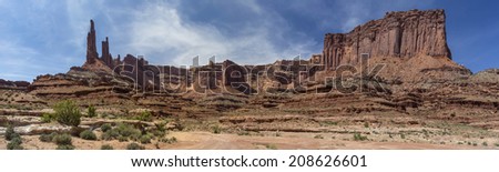 Panoramic photo along the Canyonlands National Park White Rim Trail near  Moab Utah.  Showing Washer Woman Tower and Arch, Monster Tower and  Sandcastle formations along with other rock formations.