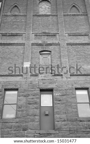Brick facade of an historic old church in Jerome,  Arizona shot in black and white.