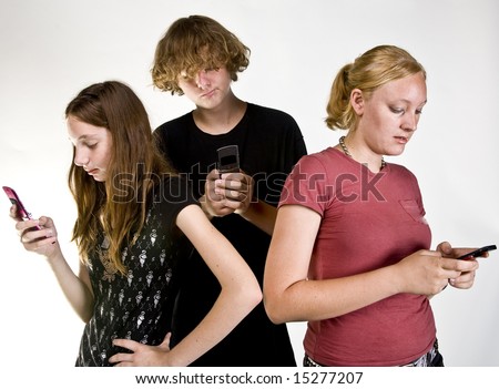 Teen-aged siblings texting on cell phones.