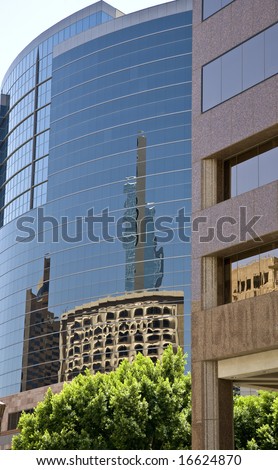Downtown Phoenix Arizona skyline photograph showing buildings with reflections.