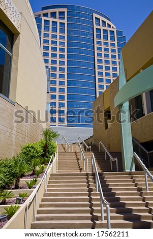 Downtown Phoenix Arizona skyline photograph showing a staircase and a tall building against a blue sky.