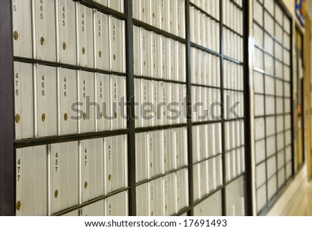 A row of post office boxes in a small rural post office.