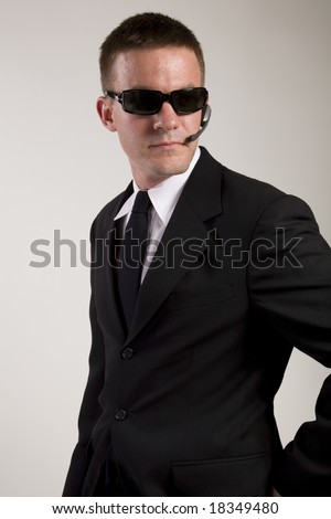 uh oh Stock-photo-young-man-suggesting-a-secret-service-agent-or-secret-policeman-being-watchful-and-observant-18349480