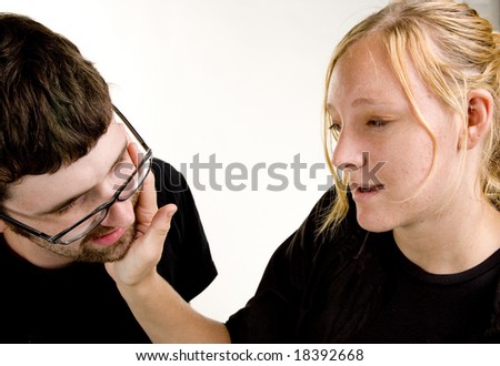 Offended young woman slaps a young man\'s face during  an argument.