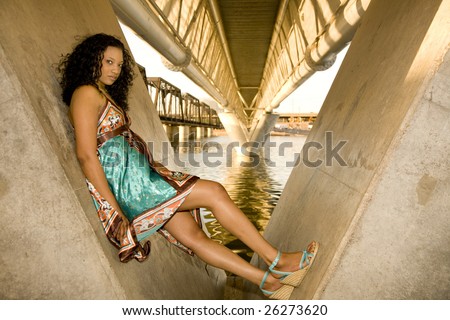 African-american Fashion model shot in an  urban setting on a waterfront.