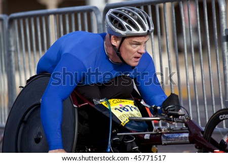 SCOTTSDALE, AZ - JANUARY 17: Peter Hawkins, wheelchair competitor, races in the P.F. Chang\'s Phoenix Arizona Marathon on January 17, 2010 in Scottsdale, AZ.