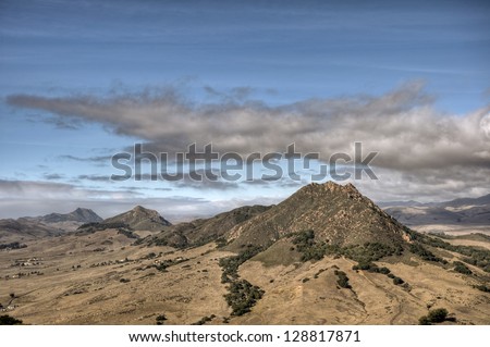 Four of the nine sister peaks in the Morros of San Luis Obispo County under an autumn sky.