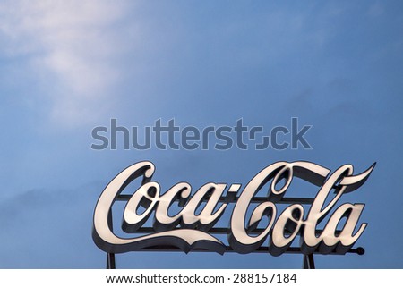 BUCHAREST, ROMANIA - June 18,2015: To celebrate the 100th birthday of the Coca-Cola contour bottle, a pop-up store will be open at University Square in Bucharest. Logo of Coca-Cola Company.