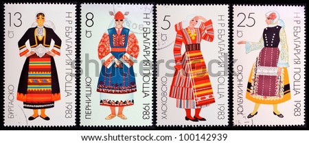 BULGARIA- CIRCA 1983: A stamp printed in Bulgaria shows young woman in traditional Bulgarian costume ,series, circa 1983 collage