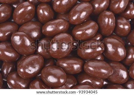 Dark brown dragee, chocolate covered nuts, background