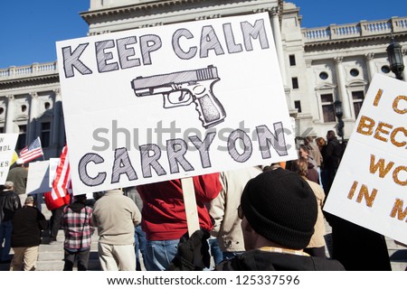HARRISBURG, PA - JANUARY 19: An unidentified protester holds a sign at a gun rights rally on the steps of the Pennsylvania State Capitol on January 19, 2013 in Harrisburg, PA.