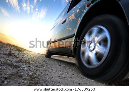Car and speed. Sunset scenery and fast car outdoor