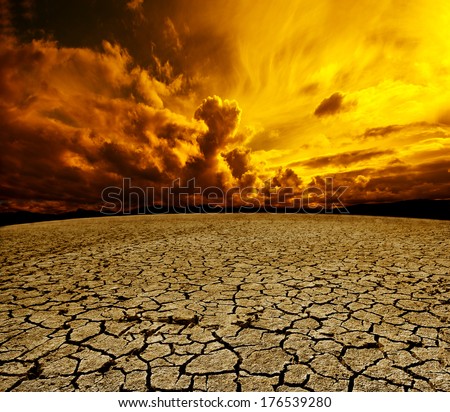 Desert and cloudy sky scenery. Dry soil and storm landscape