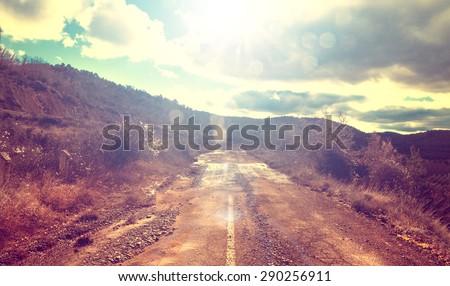 Asphalt and travel concept.Old road and sunset.Vintage style