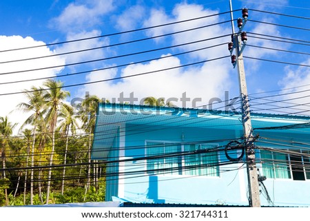 Thailand architecture.colorful facade.Light cables and light poles.Exotic travels and adventures .Thailand trip.Phuket houses