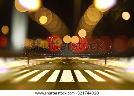 Empty street city at night and lamp post light flares.Road background.Abstract cityscape