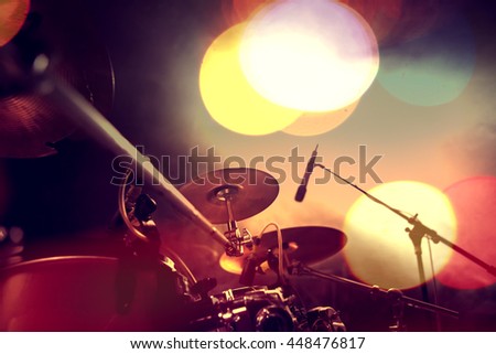 Musical background.Drum kit on stage lights performance.Live music.Concert and band on stage.Festival and show background