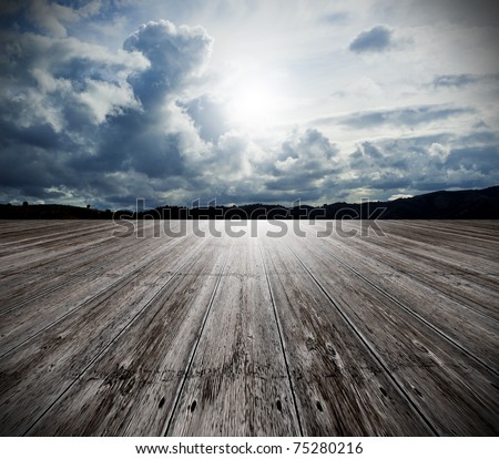background of old wood floor and cloudy sky