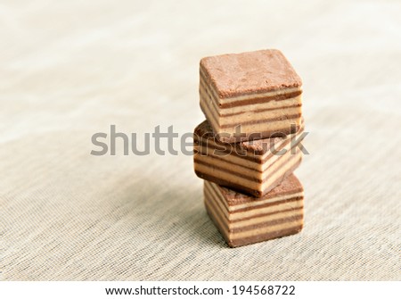 chocolate pieces isolated on wood