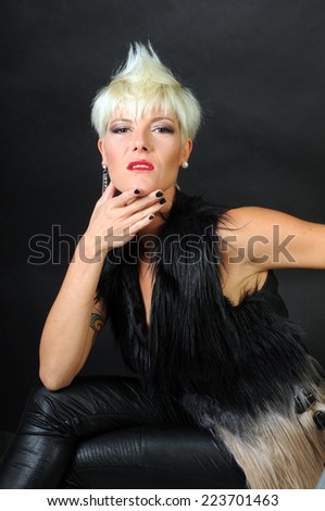 beautiful blond woman posing with attitude and self esteem