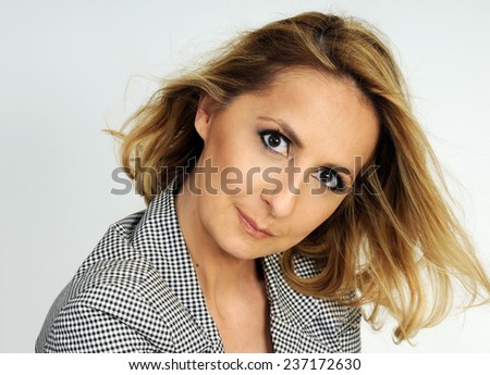 portrait of a beautiful fifty years old blond woman with perfect make up and beautiful skin