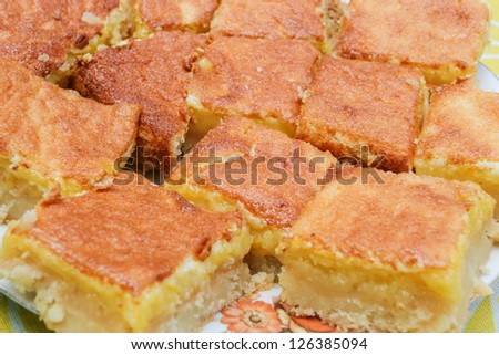 Lemon squares, a popular bar cookie dessert made with a cookie crust and lemony topping