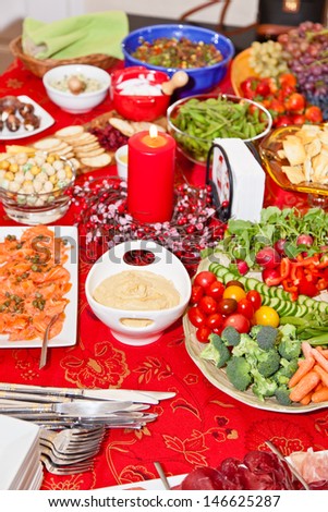 Table with lots of different foods for Christmas party.