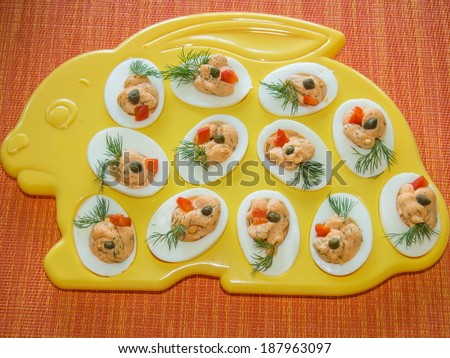 Deviled eggs or eggs mimosa are hard-boiled eggs cut in half and filled with the hard-boiled egg's yolk mixed with different ingredients.