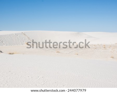 White Sands National Monument is a field of white sand dunes composed of gypsum crystals. It is the largest gypsum dune field in the world.
