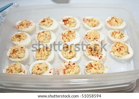 Deviled eggs or eggs mimosa are hard-boiled eggs cut in half and filled with the hard-boiled egg\'s yolk mixed with different ingredients.