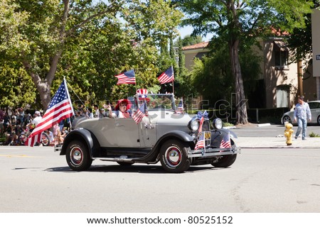 SAN JOSE, CA, USA - JULY 4: 4th of July Rose, White and Blue Parade. It is a two mile route that winds through some great old neighborhoods in the Rose Garden District in San Jose, CA, USA, July 4, 2011, unidentified people