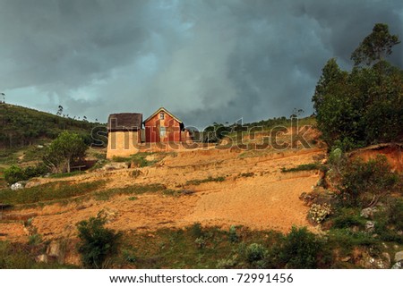 Before the Storm: landscape of rural zone of Madagascar shot just before a storm - seemingly abandoned house on the land.
