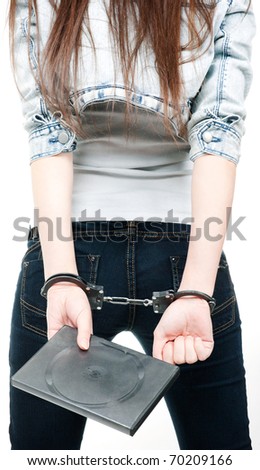 stock photo The woman from behind handcuffed with a box of software
