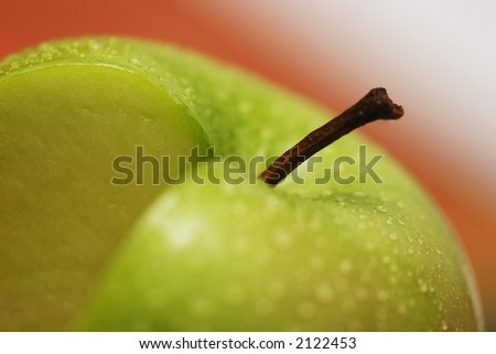 Granny Smith apple with a slice removed