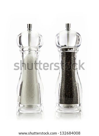 Salt and Pepper grinders on white background