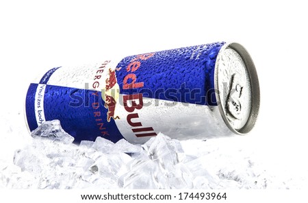 SWINDON, UK - FEBRUARY 2, 2014: Can of Red Bull on a bed of ice over a white background